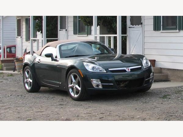 Saturn City Bug The car is a SATURN SKY (aka GM Kappa / Opel GT / Pontiac Solstice)